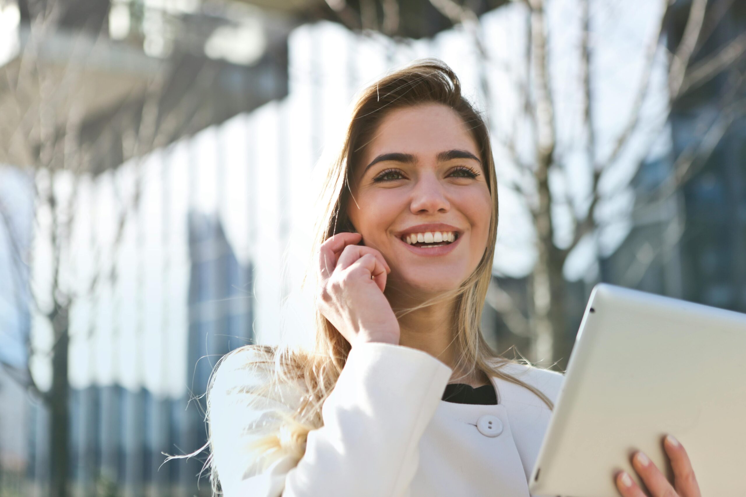 A woman on phone as Communications Manager